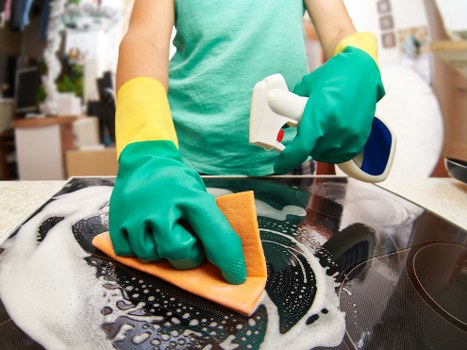 Applying gentle cleaning solution to a mattress stain